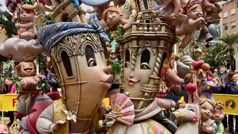 Traditional ninots depicting a cheeky take on Valencia's historic towers, part of the Fallas festival.