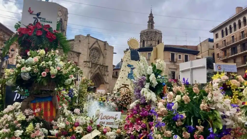 A sea of flowers surrounds the statue of the Virgin Mary as part of the La Ofrenda tradition during Valencia's Fallas festival