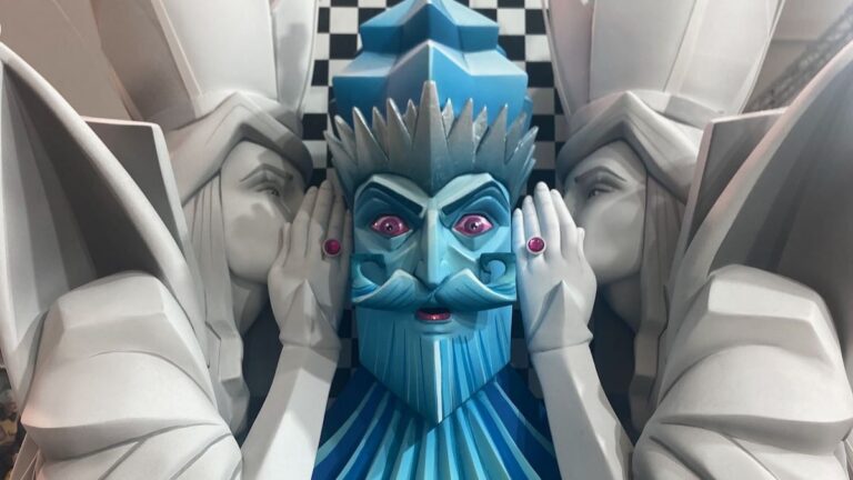 Close up of a Fallas sculpture of a king in blue color.