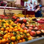 oranges and manges for sale at a local market