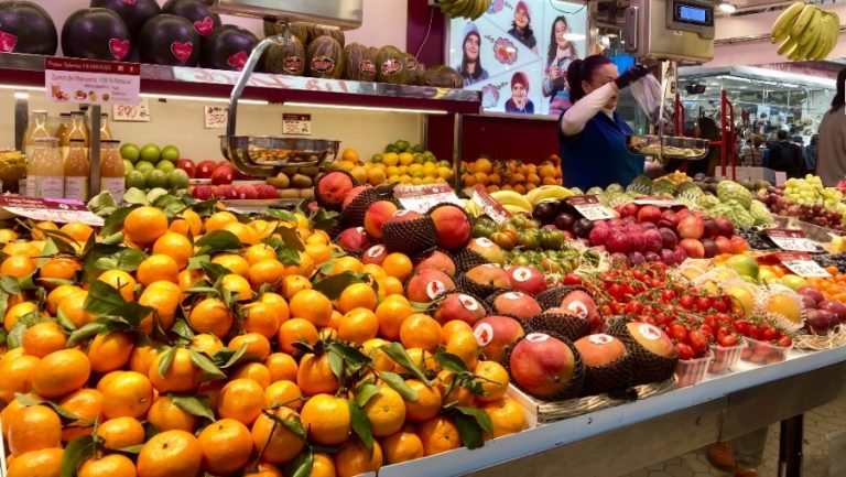 oranges and manges for sale at a local market