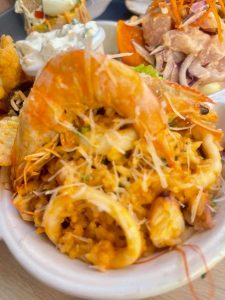 A portion of seafood rice with shrimp and squeezed, known as chaufa in Peruvian food.