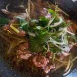 Bowl of Vietnamese rice noodles in beef broth