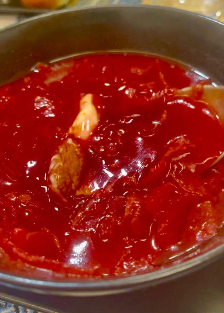 A bowl of red borscht soup