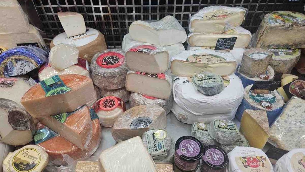 A large variety of cheeses on display