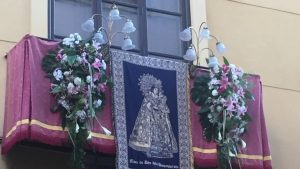 A balcony decorated with the image of the Virgin Mary for the religious procession in Valencia celebrating Fiesta de la Virgen de los Desamparados