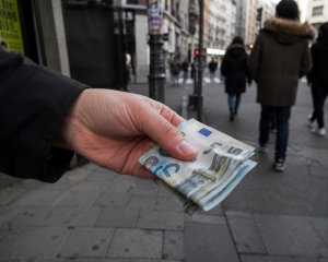 Money is handed on the street.