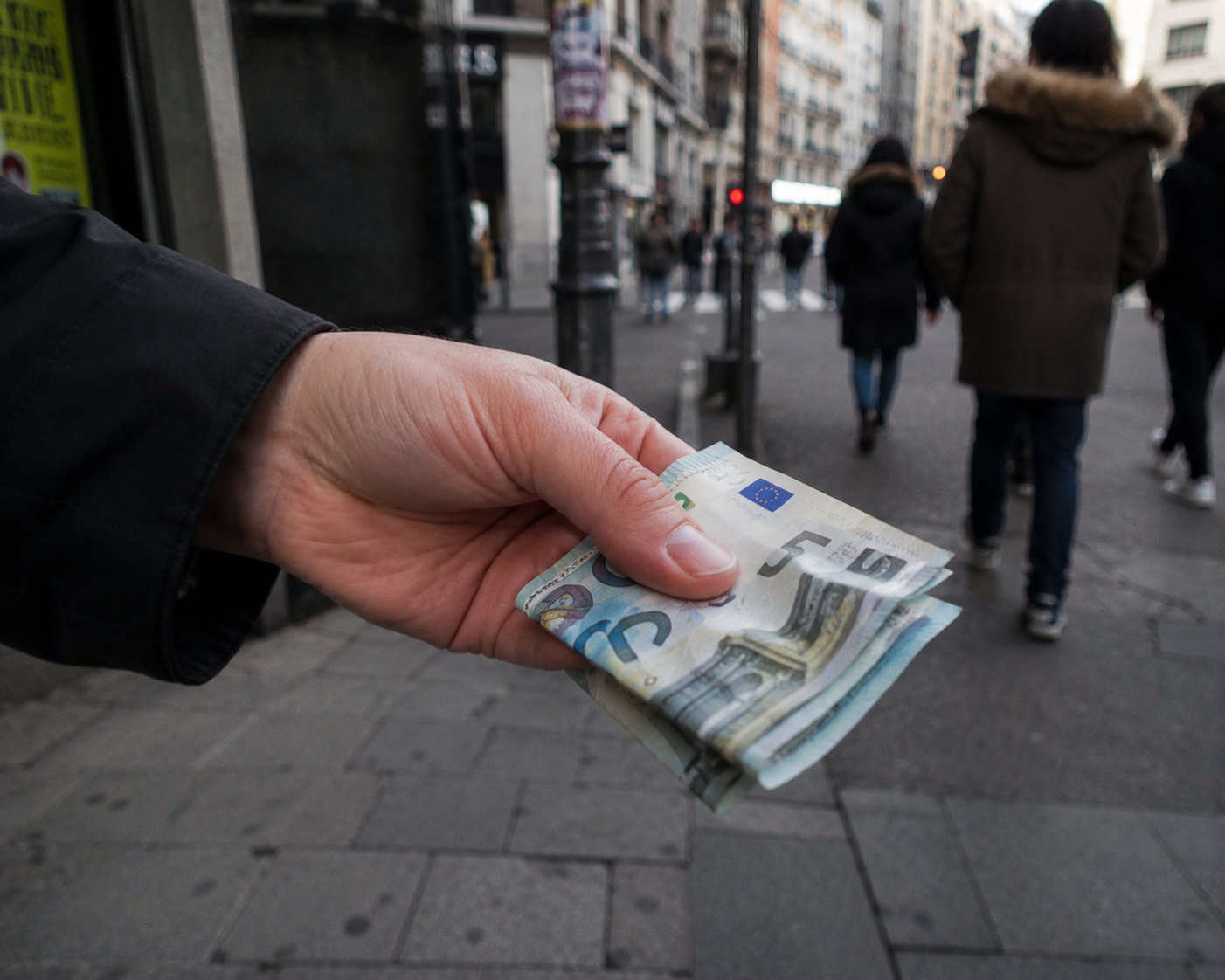 Money is handed on the street.