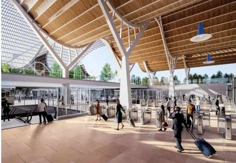 A digial rendering of passengers using the futuristic design and high, wave-like ceilings of the proposed Nueva Estación Central train station envisioned by Valencia's City Council.