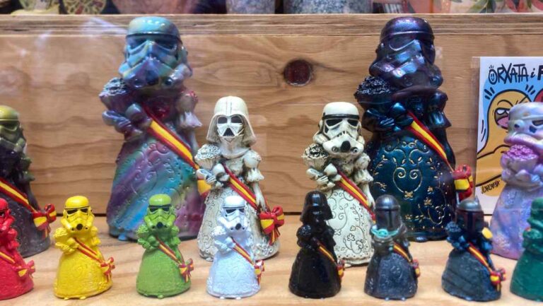 Satirical figurines showing Star Wars Storm Troopers in traditional Valencian dress in a tourist storefront in Valencia