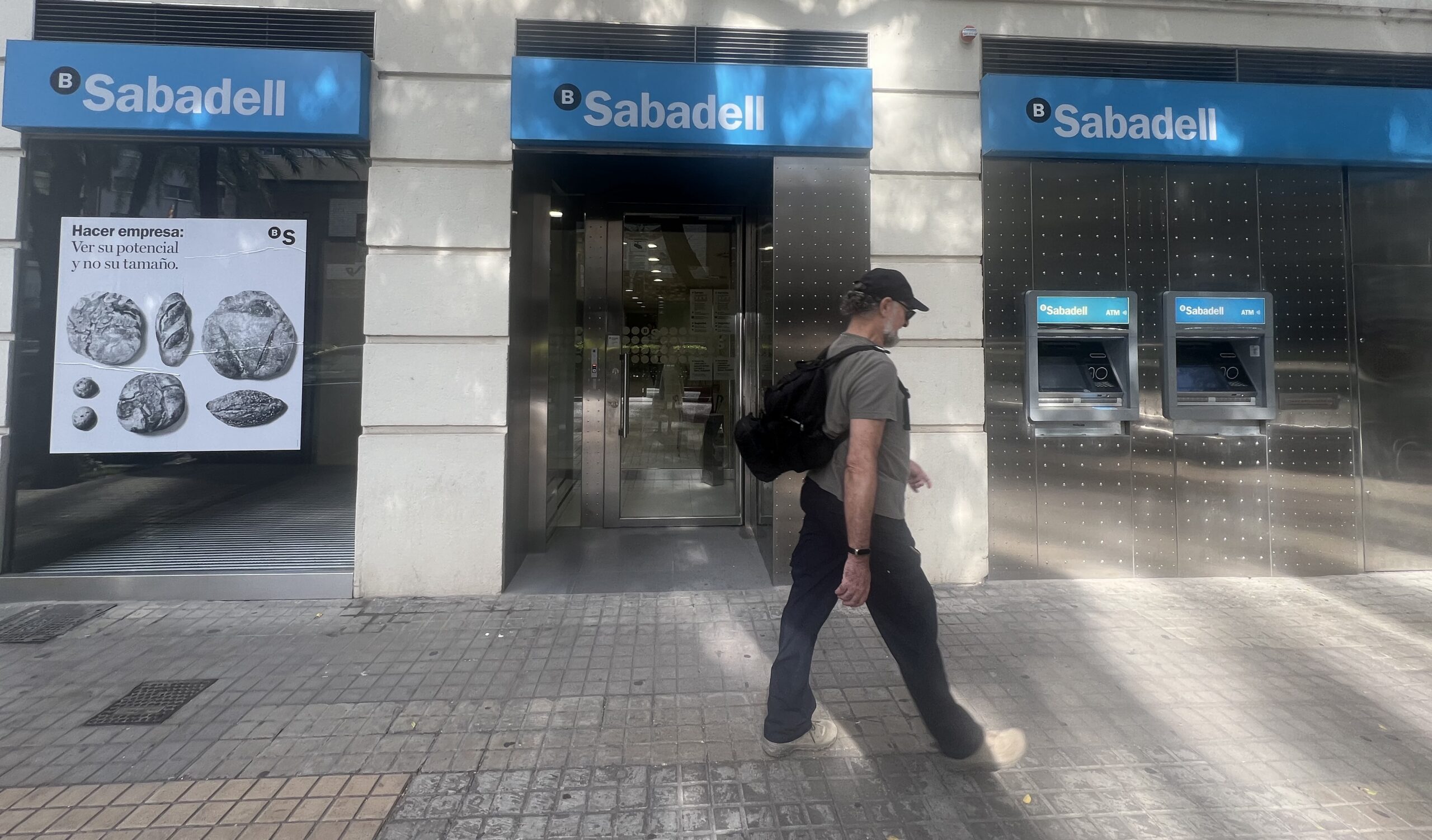 A man walks by a ban in Valencia